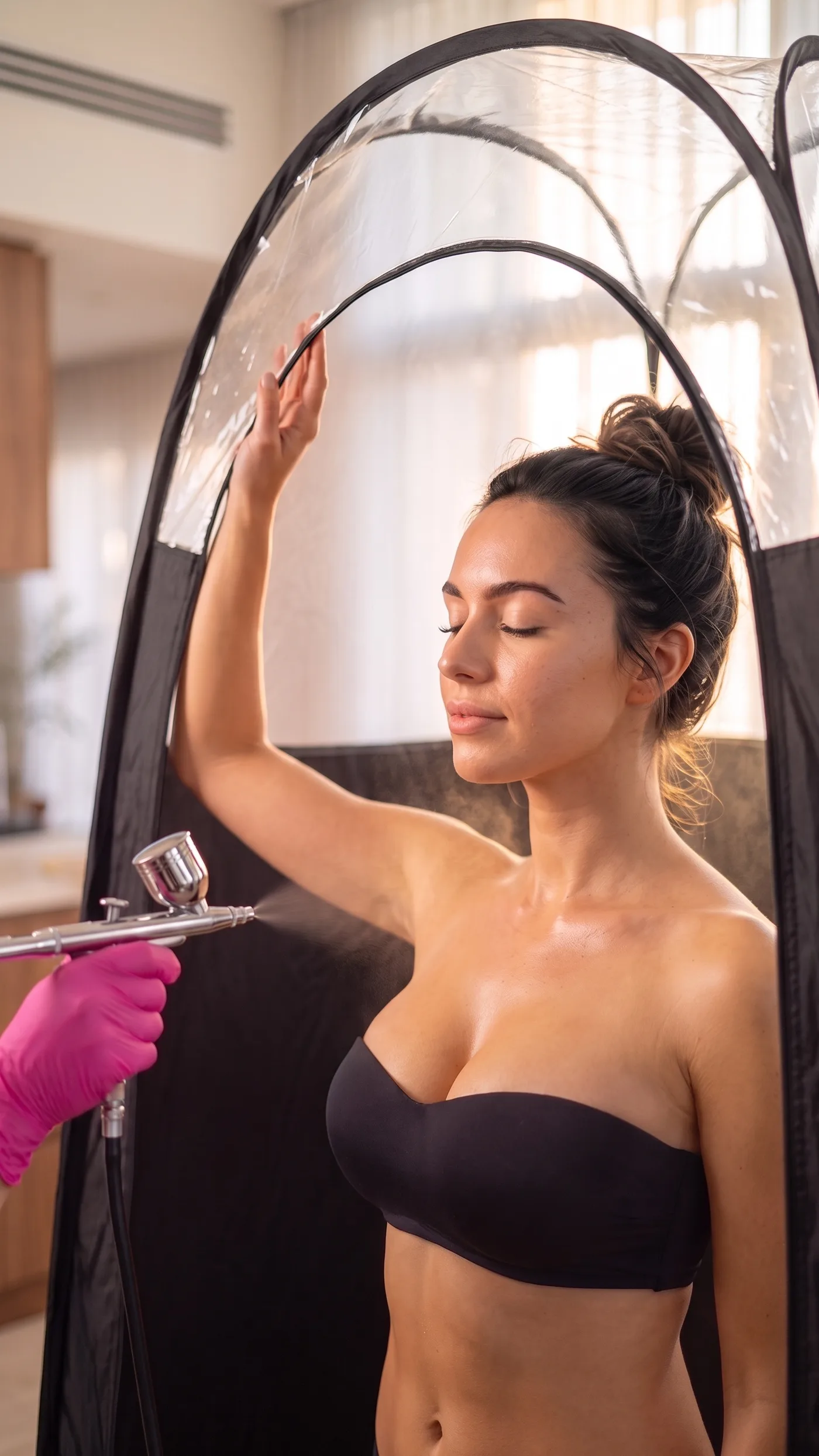 Relaxed client inside the GLOW17 tent, at-home spray tan in Boisbriand