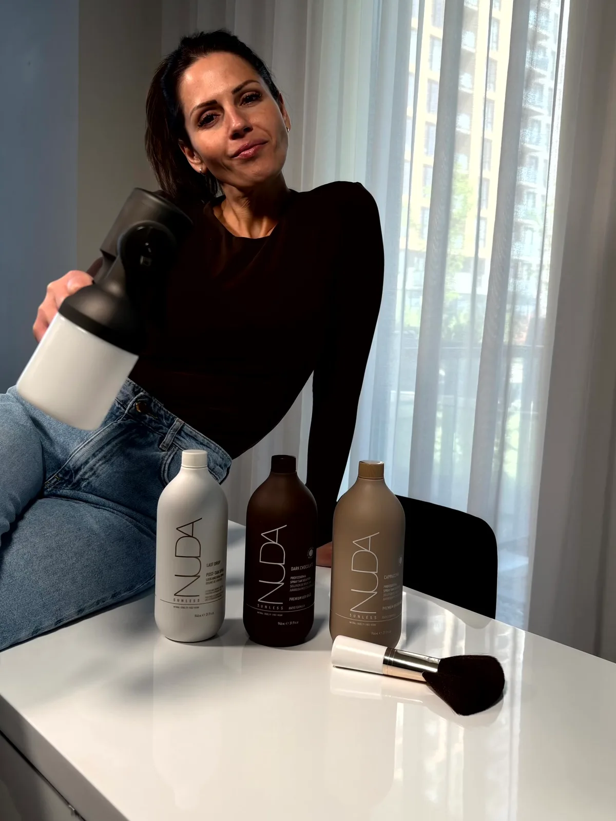 GLOW17 spray gun and NUDA formulas before a session