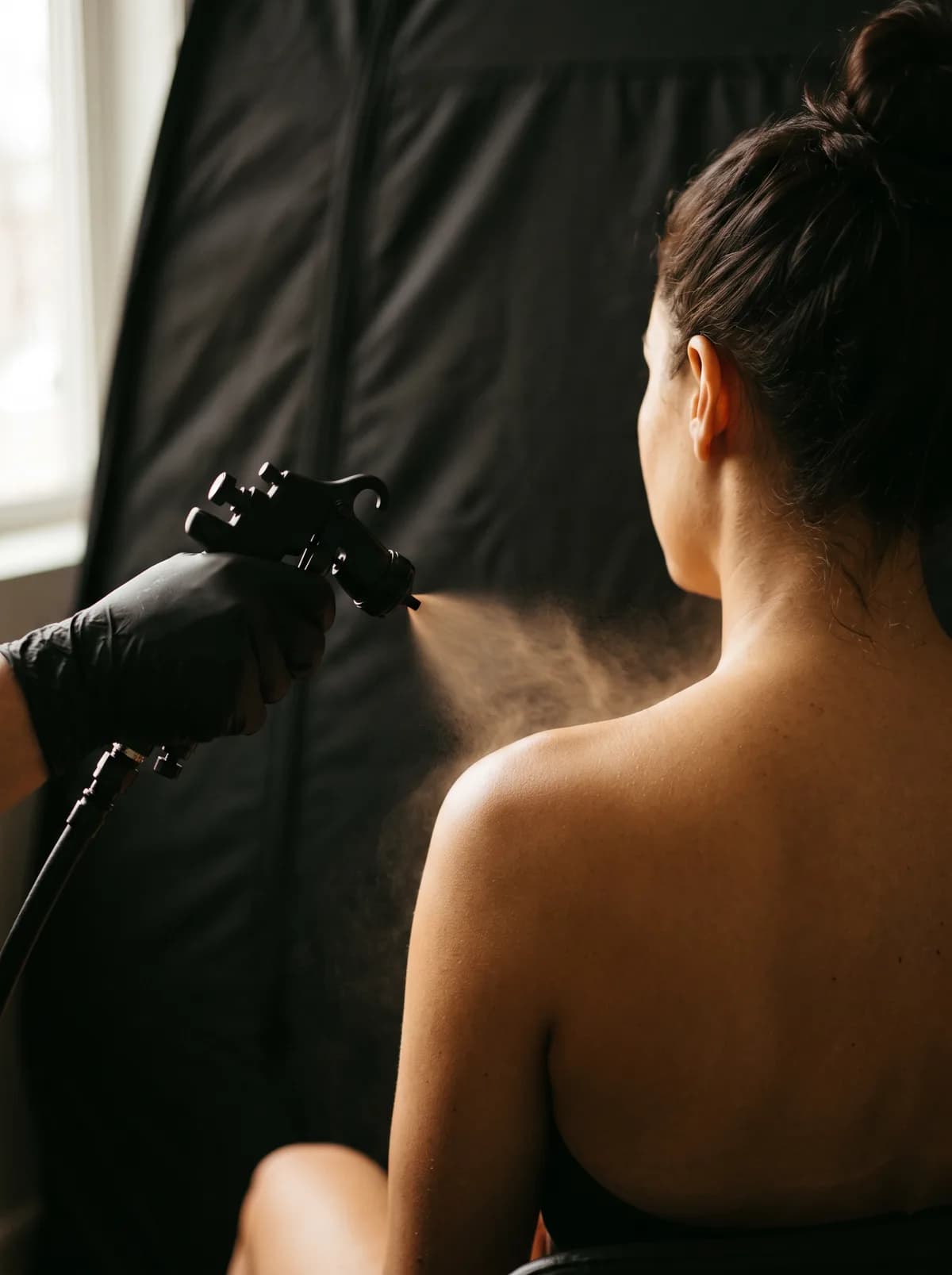 Fine mist applied with the spray gun during a GLOW17 session
