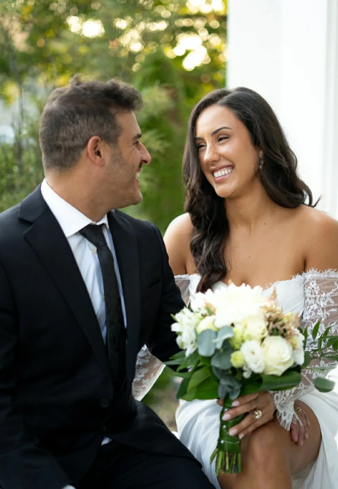 Bride tanned by GLOW17, bouquet in hand, on her wedding day