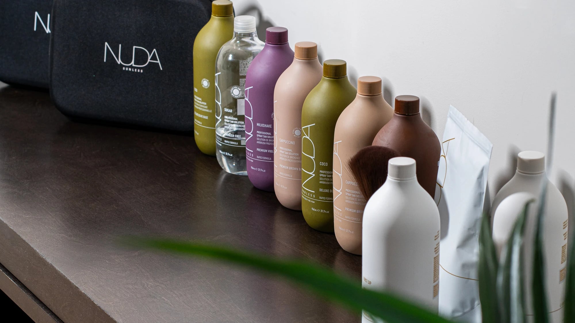 The NUDA formulas lined up before a GLOW17 spray tan session